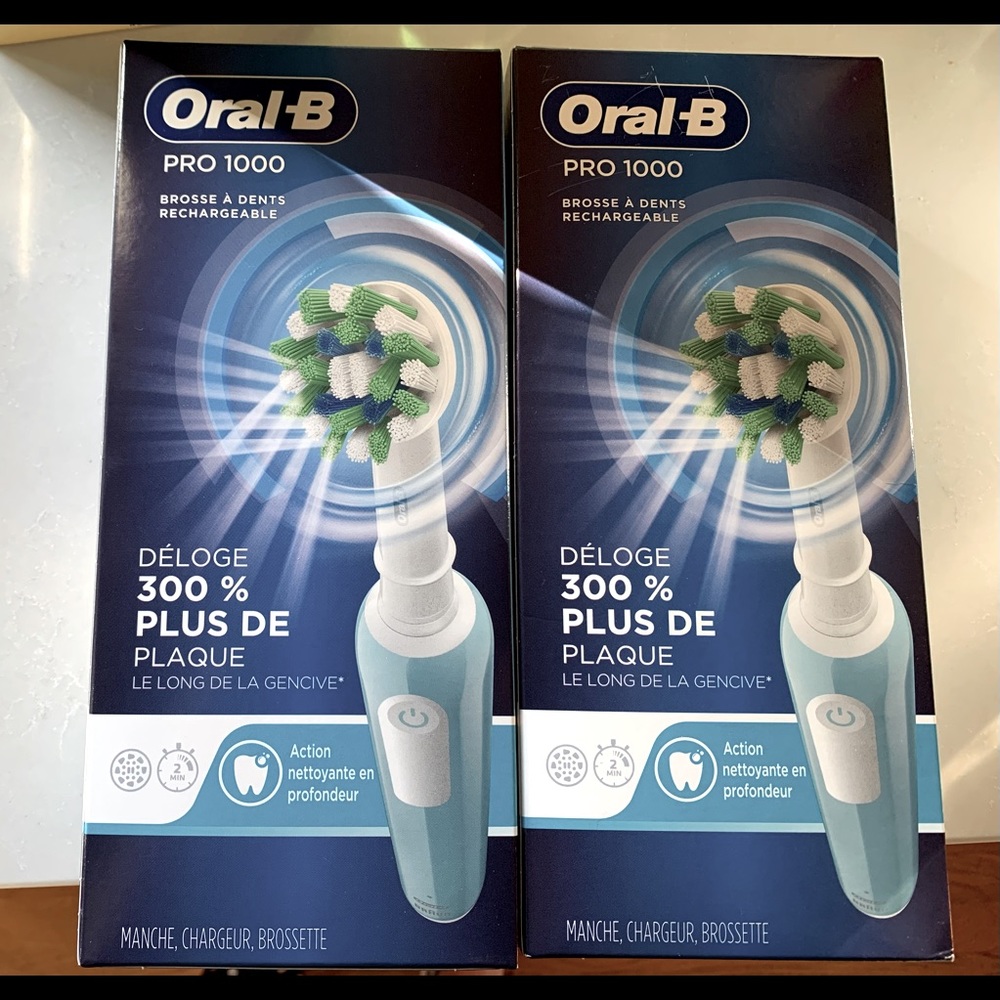 NIB Oral B Pro 100 rechargeable toothbrush’s- set of two